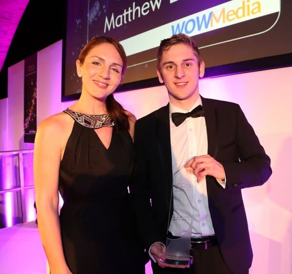 Matt Lovett receiving a business award